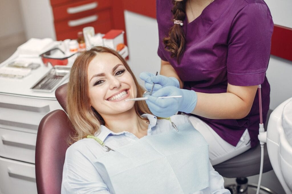 beautiful girl sitting dentist s office (1)