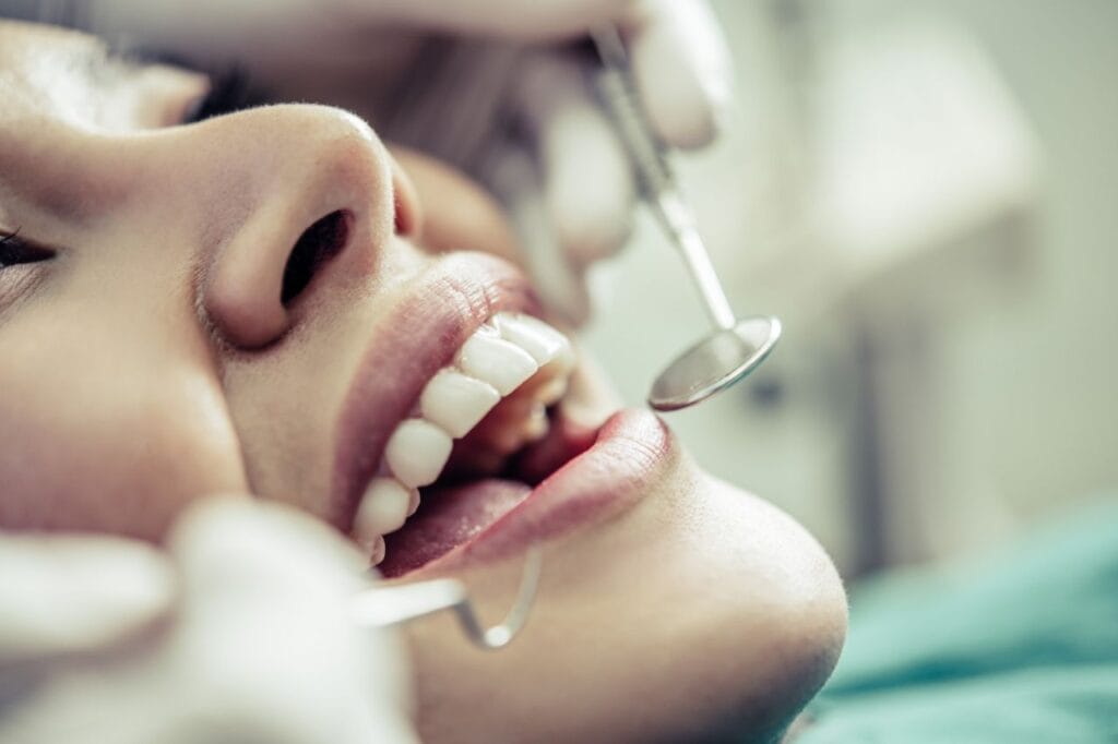 dentists treat patients teeth