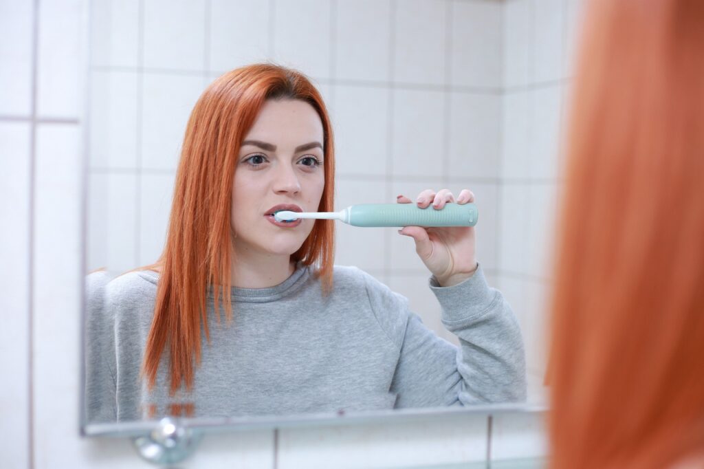 red-haired-woman-brushing