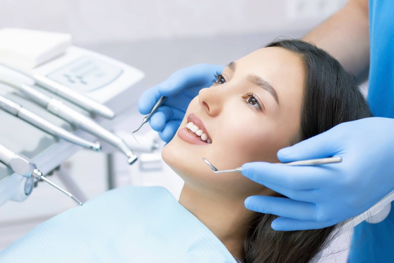 young female patient with pretty smile examining dental inspection at dentist clinic. healthy teeth and medicine, stomatology concept